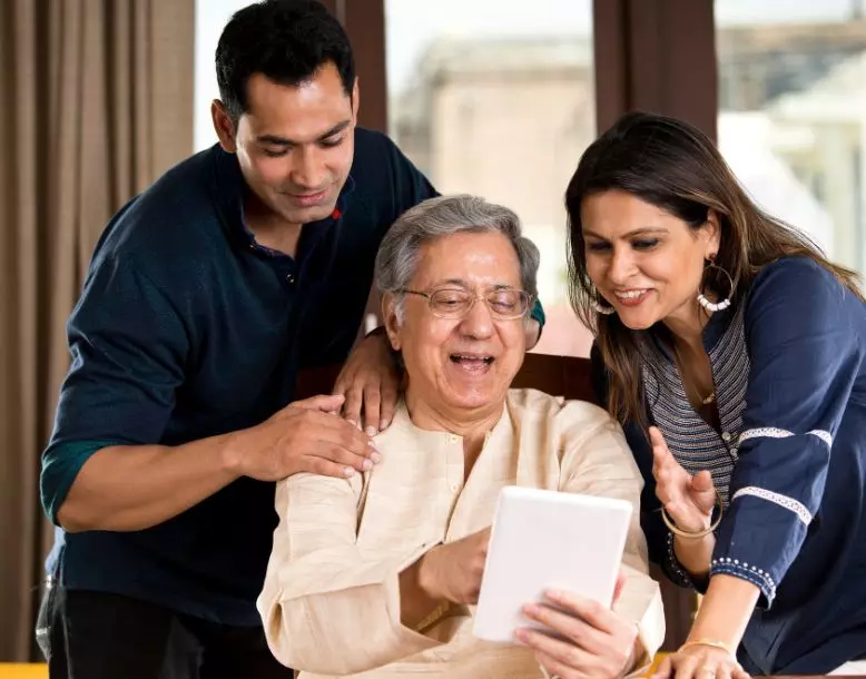 A family reviews a tablet together
