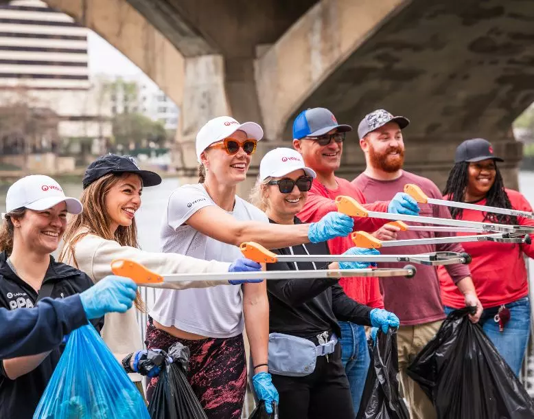A group of Veolia employees volunteering at a community clean-up event