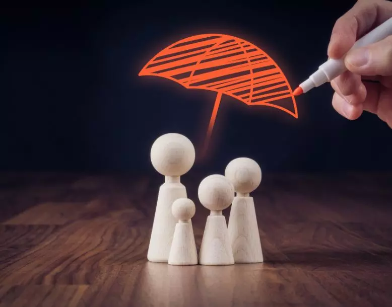 A representation of a family with an umbrella above them